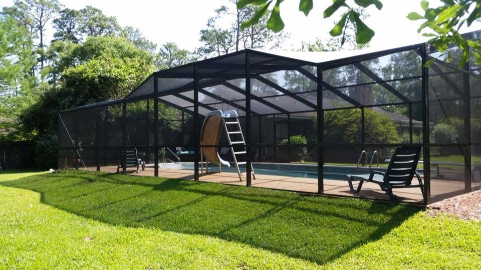 Dark bronze pool screen enclosure with tall roof frame